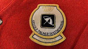 The patch on the red cardigan sweater awarded to the winner of the Arnold Palmer Invitational.